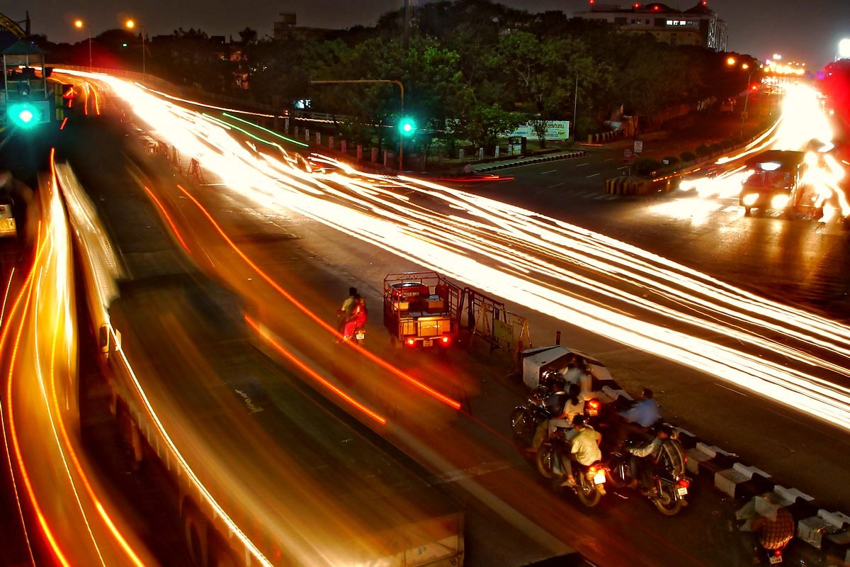 Night traffic streaming along Anna Salai near the KitchenMend repair centre in Chennai