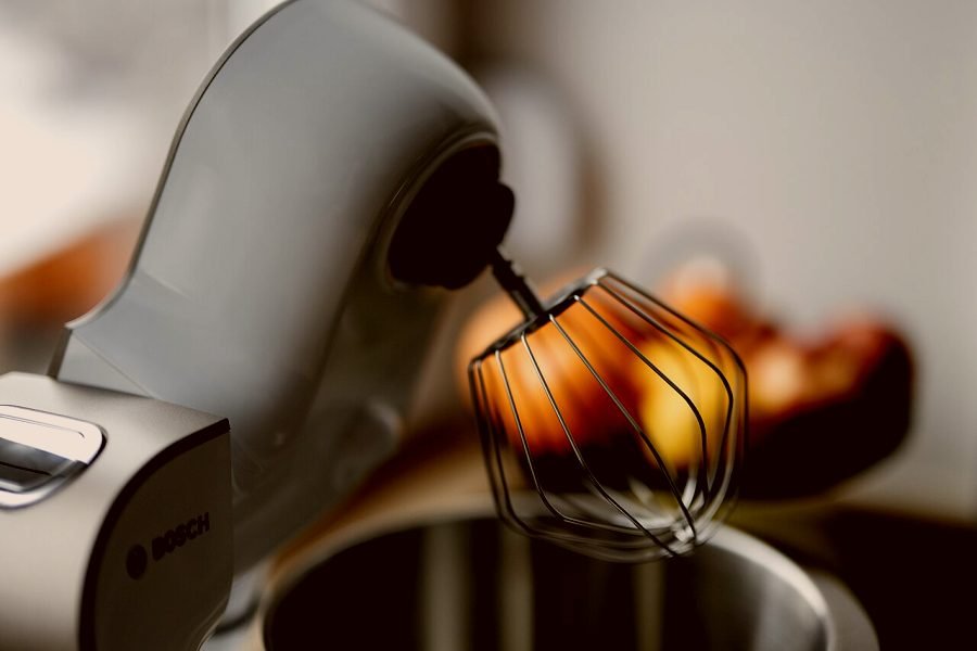 A repaired kitchen mixer back at work beating batter in its bowl