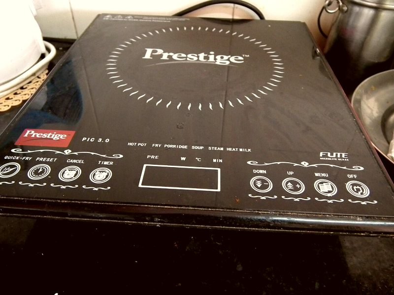 A Prestige induction cooktop with its touch control panel