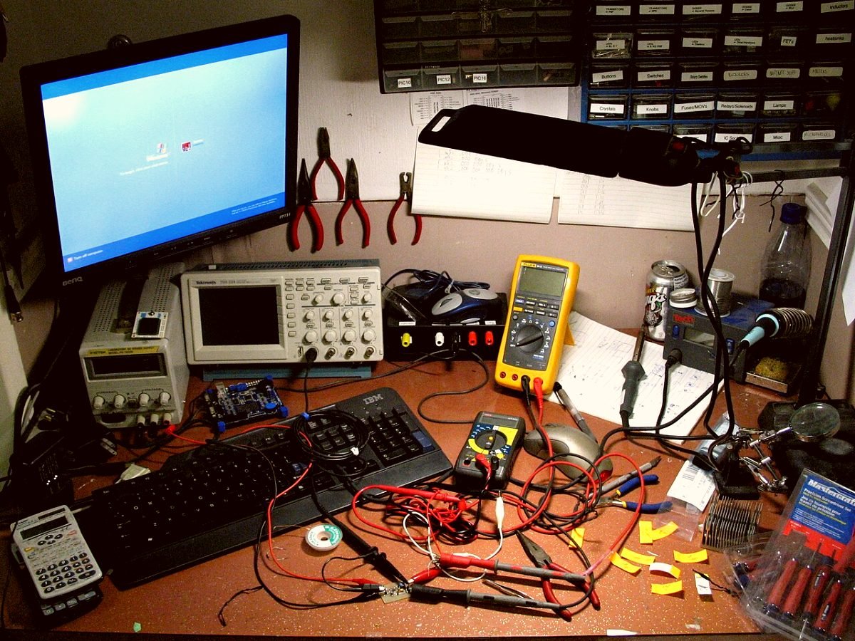 The KitchenMend bench in Teynampet: oscilloscope, meters and a soldering station set up for board-level work